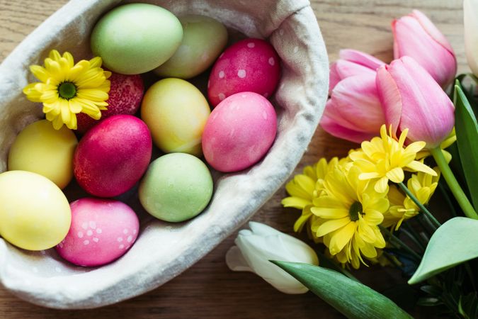 Flowers and Easter eggs on table