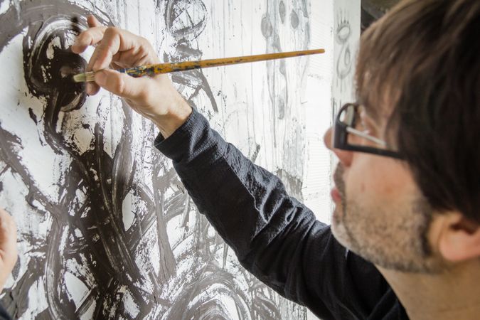 Painter artist working on a oil canvas