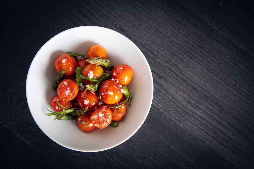 Fresh cherry tomatoes sauteed with green asparagus and rosemary