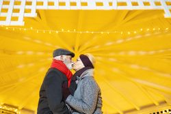 Older couple kissing under a gazebo