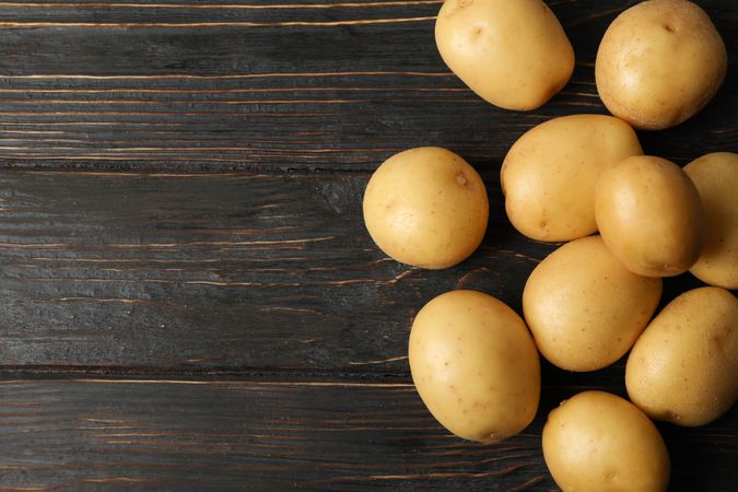 Potatoes on dark kitchen table