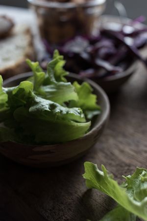 Fresh salad in bowl on table