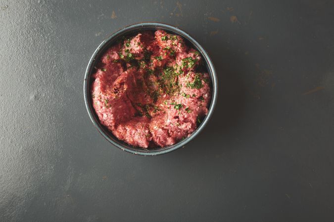Above view of ground beef with herbs