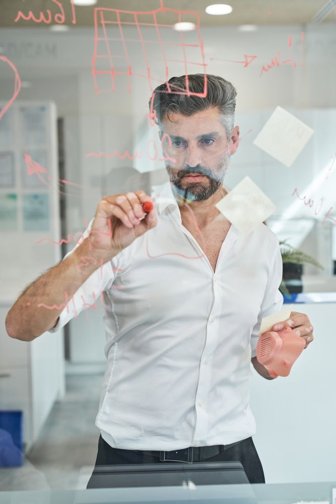 Serious man creating new sample of covid mask