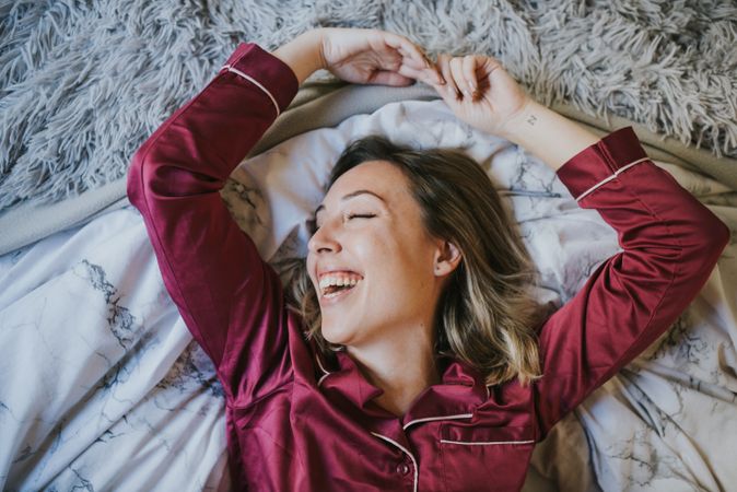 Woman smiling in bed
