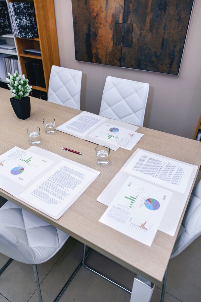 Desktop with graphs and diagrams in office ready for meeting