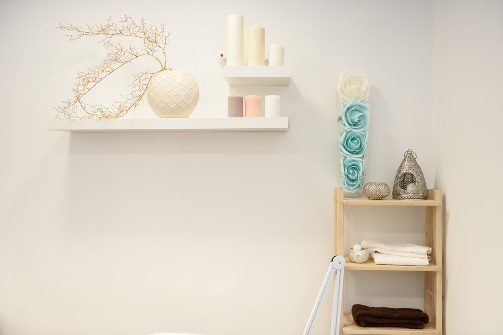 Wall of beauty salon with flowers and candles