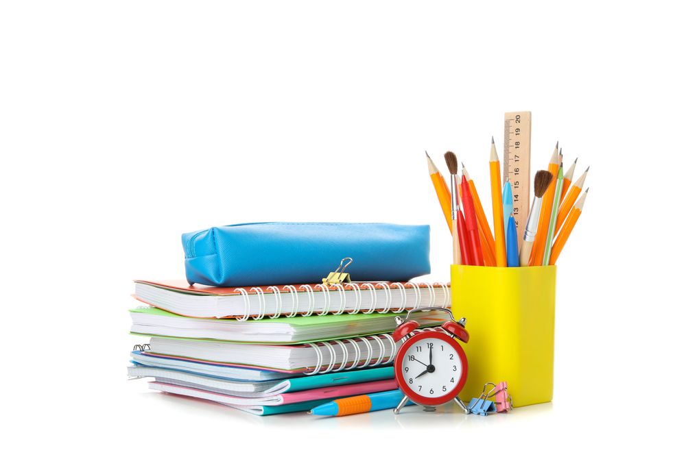 Notebooks with glasses, and stationary in blank space