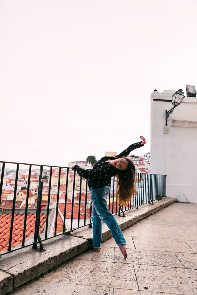dancer dancing against cityscape