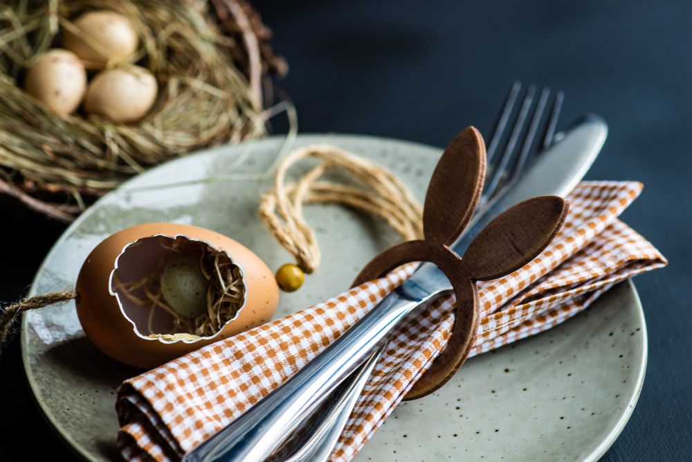 Eater table setting with decorative egg shell and checkered napkin in a rabbit ring