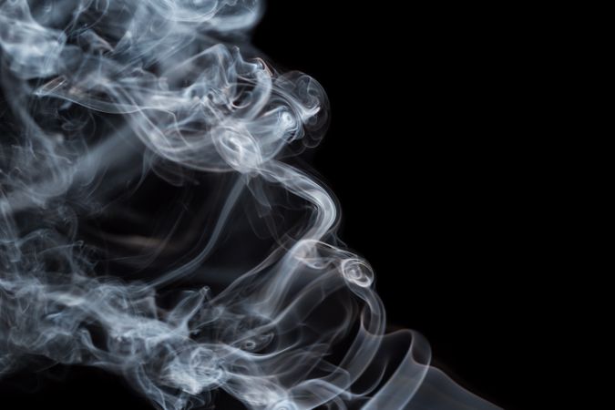 Abstract smoke moving on dark background