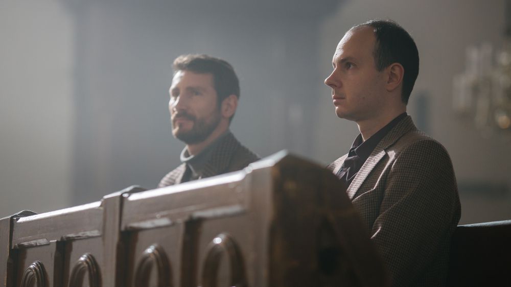 Two Faithful Parishioners In Grand Old Church.