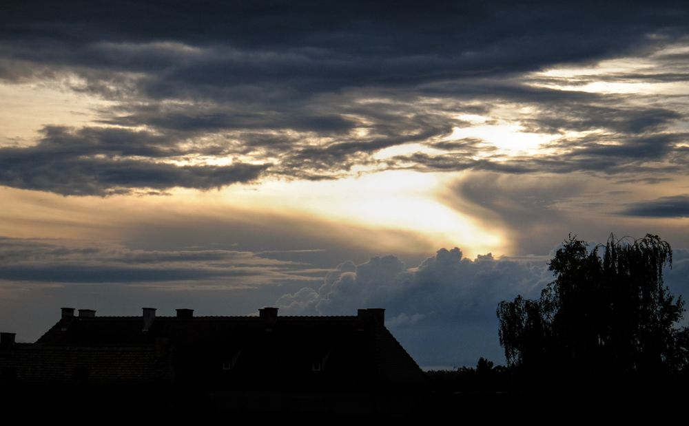 Sunset on cloudy dark day