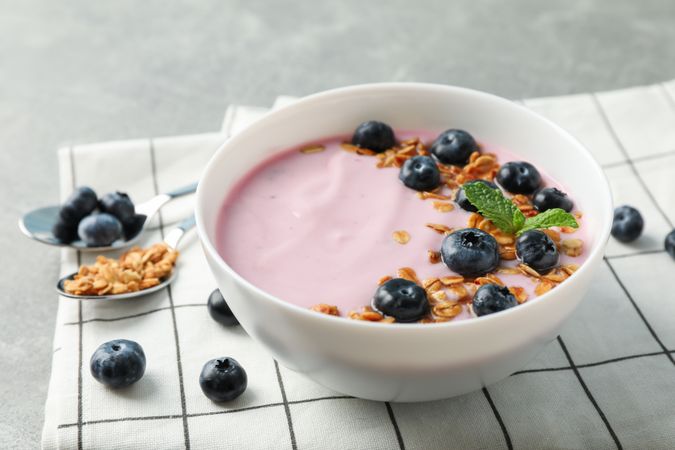 Composition with tasty yogurt on grey background, space for text