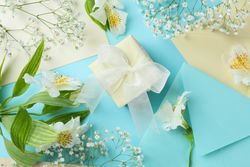 Gift box with flowers and envelope