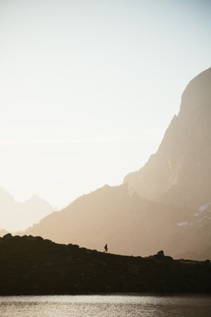 Majestic mountain landscape with human silhouette