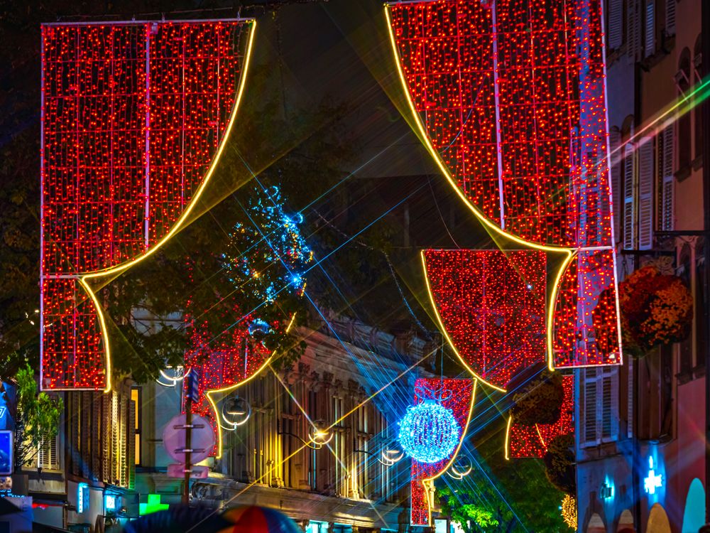 Colorful red lighting in the streets at Christmas time, Strasbourg, France