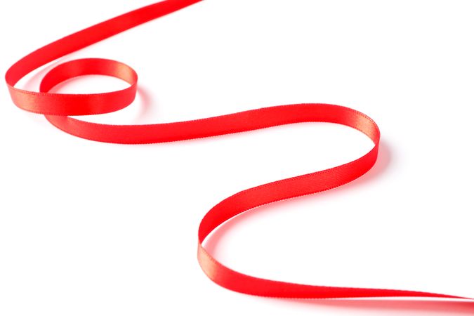 Red ribbon isolated on blank background. Gift concept