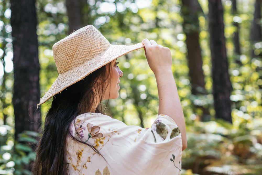Young woman walking in the forest