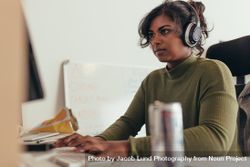 Woman Wearing Headphones Coding On Desktop Computer - Free Photo ...