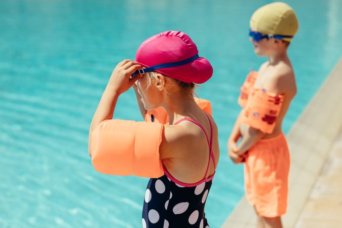 Two children getting ready for swimming lessons