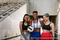 Three multi-ethnic female soccer players at the stadium 0L1MX5