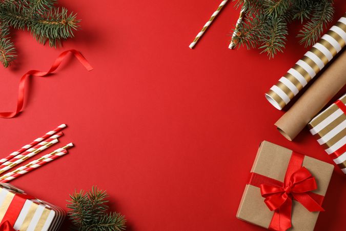 Composition with Christmas accessories on red background, space for text