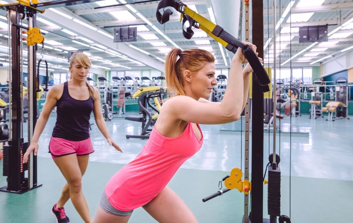Two woman working out in gym