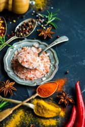 Pink Himalayan salt on dark counter with copy space