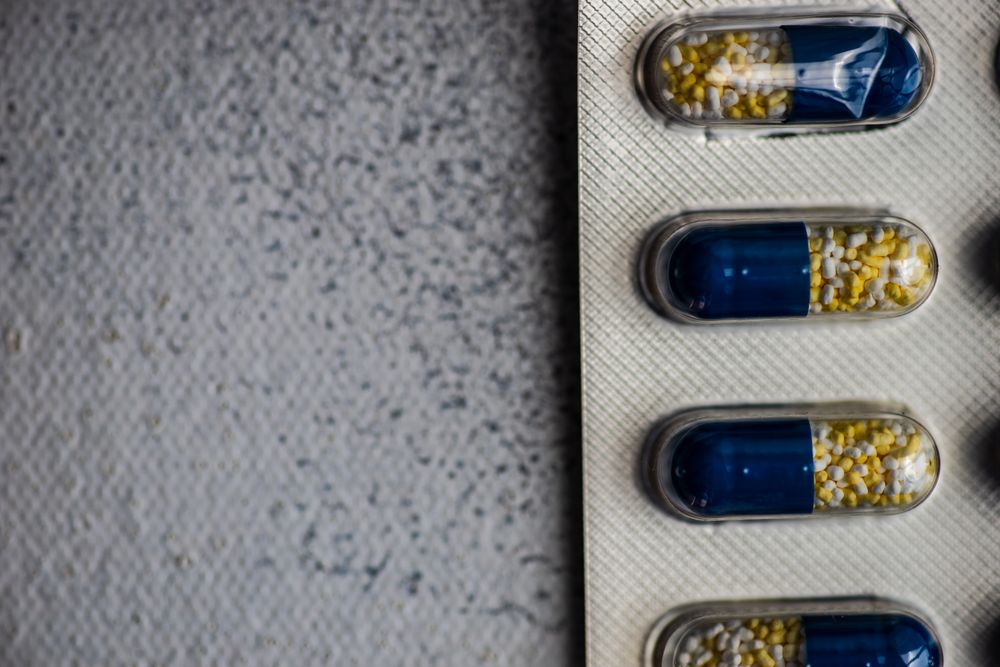 Top view of pills on grey counter