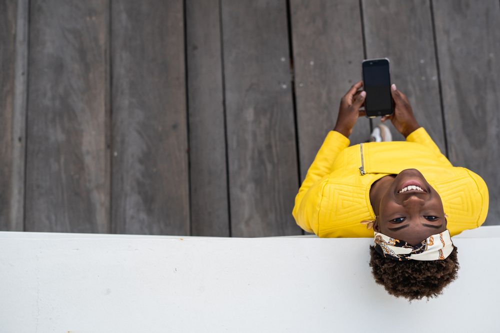 Tranquil female using mobile phone