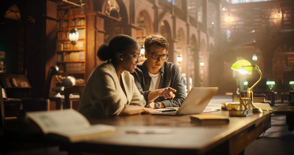 Engaged Multiethnic Students Collaborating on a Project in a Historic Library.