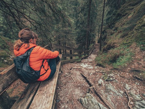Tourist resting hiking path