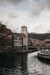 Cloudy sky over buildings and channel