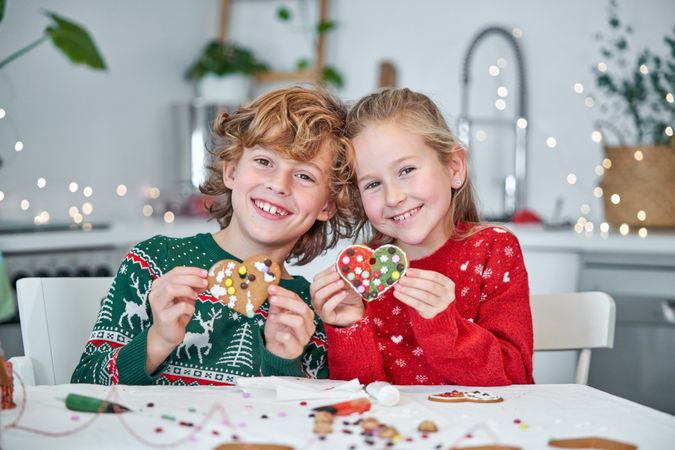 Cheerful children with heart shaped cookies