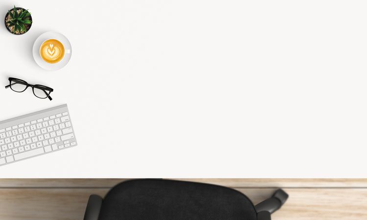 Modern workplace with coffee cup and smartphone or laptop copy space on office table background. Top view. Flat lay style