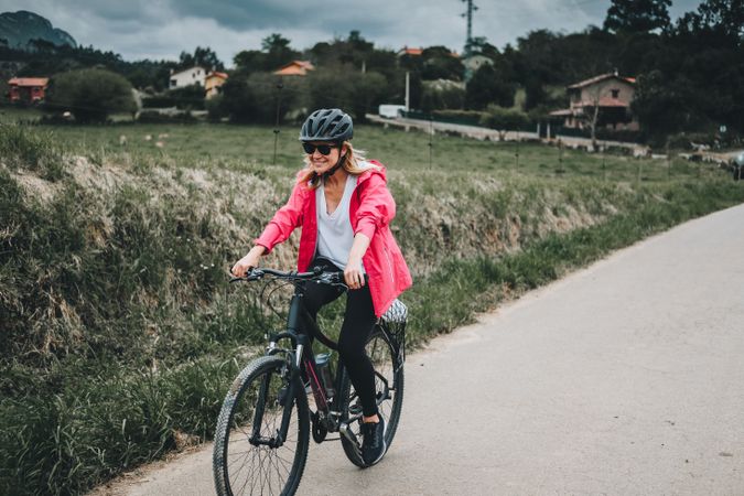Smiling female riding bicycle