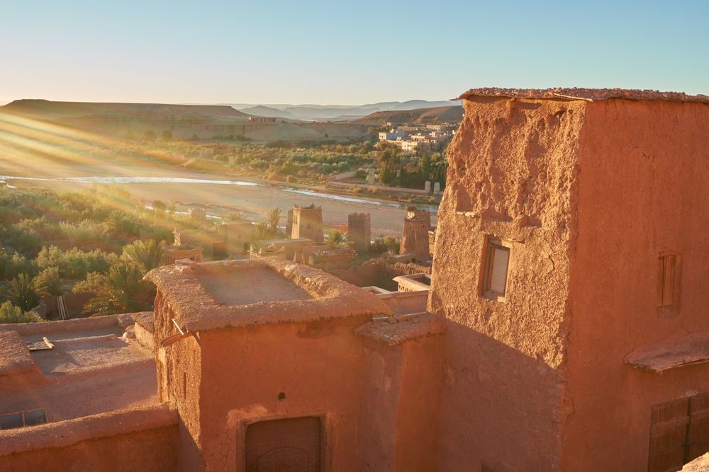Ancient city near river in desert and wonderful sky