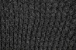 Detailed dark grey knitted fabric background texture.