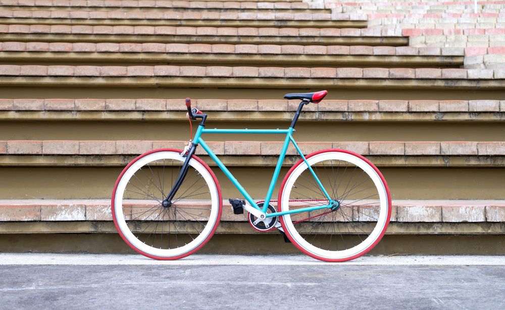 Bicycle leaned against steps outside