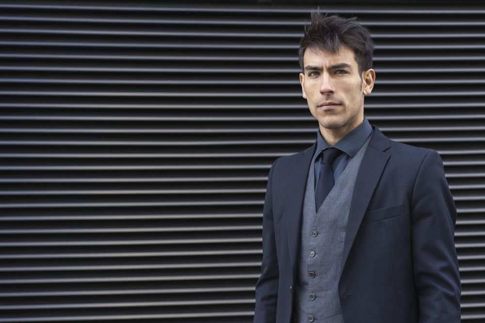 Front view of an executive man wearing a suit while looking at camera
