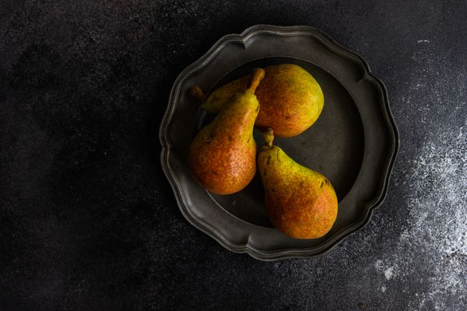 Three pears on plate