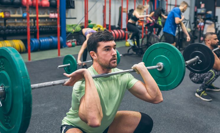 Man practicing weightlifting in the gym