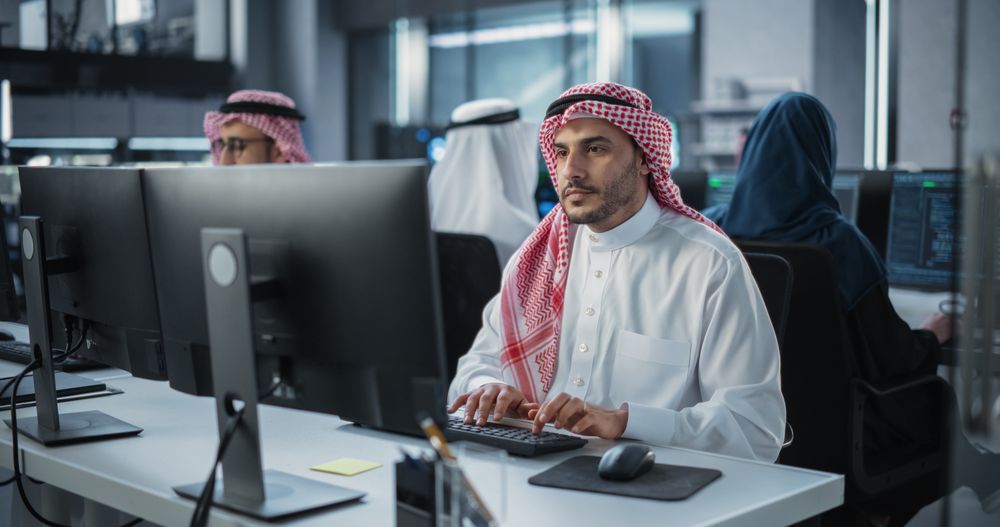 Team of Talented Young Middle Eastern Professionals Working in a Technological Research and Development Agency.