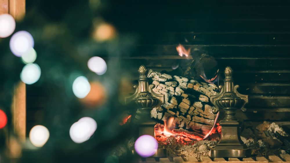 Christmas tree and fireplace in the background