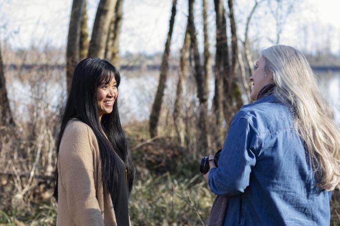 Two women talking on a break during a photoshoot