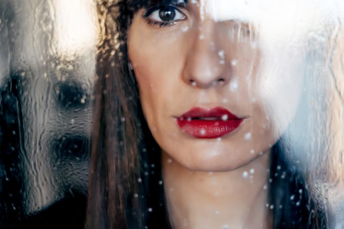 Stylish woman kissing glass