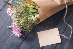 Message card and a bouquet of flowers