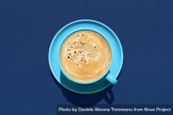 Cup of coffee above view on a blue background 41LNL5