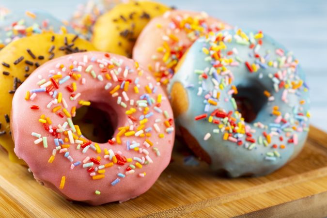 Delicious assorted colorful donuts on the table.